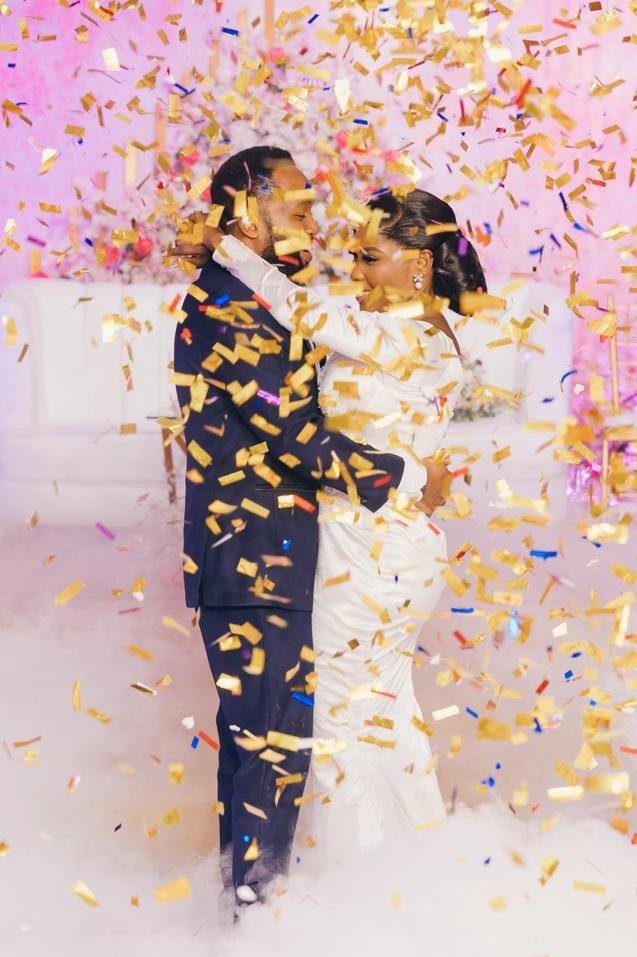 Couple embracing under confetti